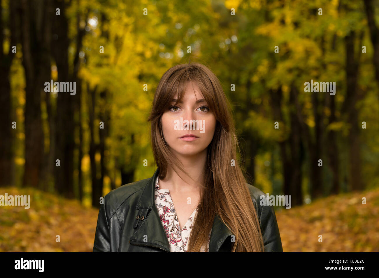 Portrait of a girl in an autumn park Stock Photo - Alamy