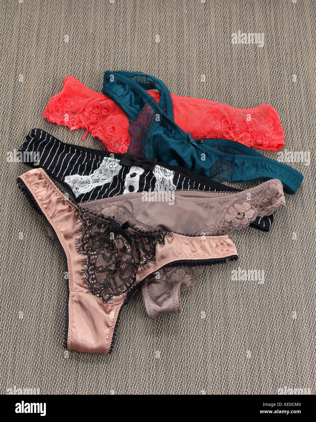 Sexy women lingerie colorful silk panties pile Stock Photo - Alamy