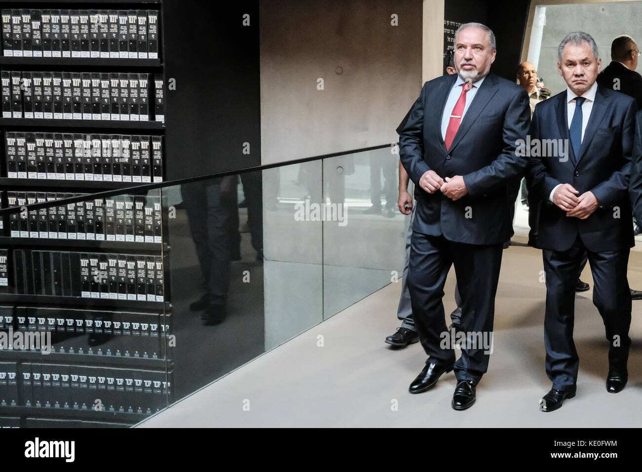 Jerusalem, Israel. 17th Oct, 2017. Minister of Defense of the Russian Federation, General of the Army, SERGEI SHOIGU (R), gazes up at enlarged Pages of Testimony in the Hall of Names at Yad Vashem Holocaust Museum, where Pages of Testimony of more than 4,000,000 Jewish Holocaust victims are eternally preserved. Escorted by Israeli Defense Minister, AVIGDOR LIEBERMAN (L), Shoigu toured the Yad Vashem Holocaust Museum, participated in a memorial ceremony, visited the Children's Memorial and signed the museum guest book. Credit: Nir Alon/Alamy Live News Stock Photo