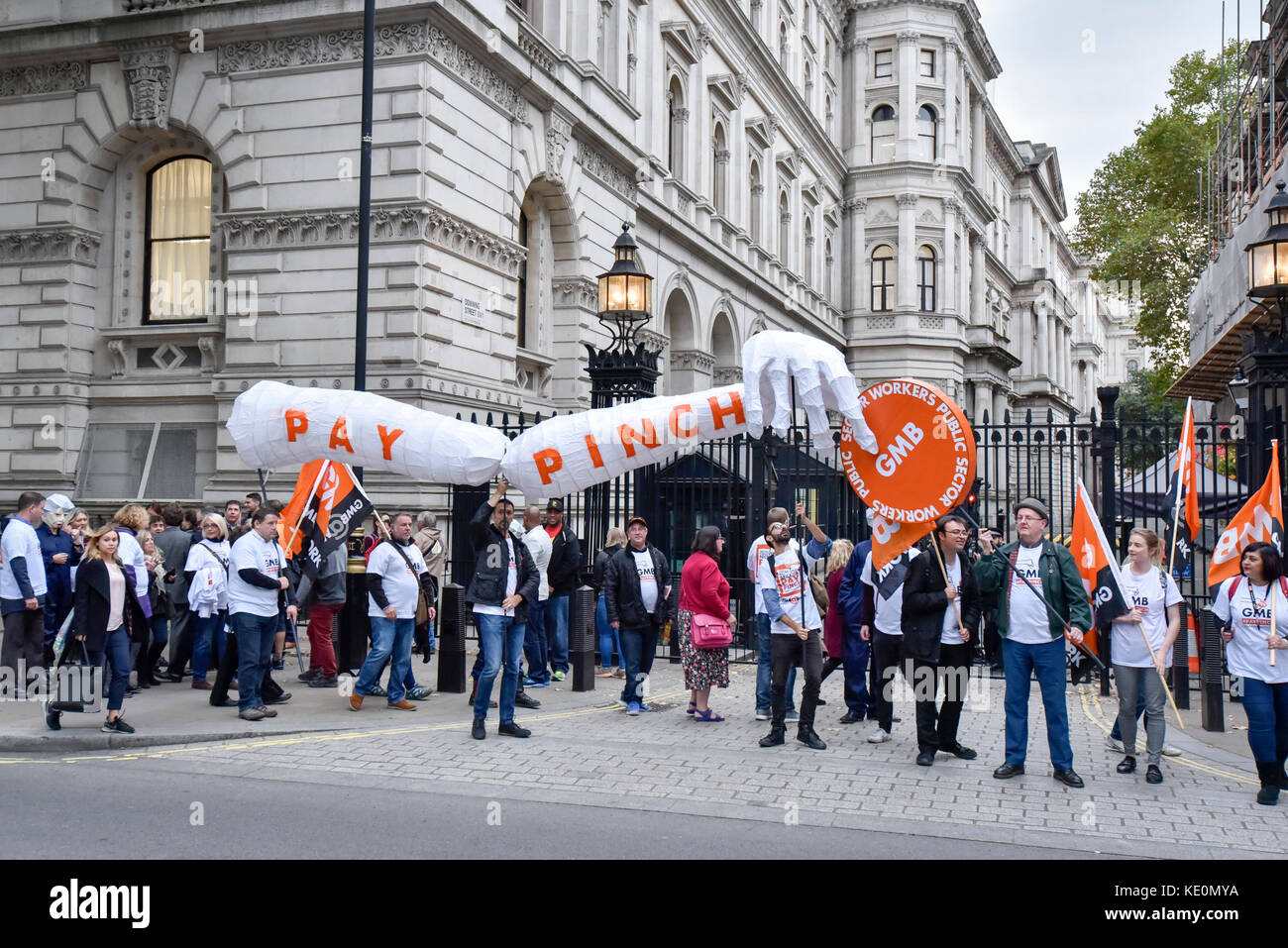 London, UK. 17th Oct, 2017. Public sector workers, several wearing masks depicting Theresa May, Prime Minister, as a 'MayBot' outside the Downing Street ahead of a rally in Parliament Square against the cap on public sector workers' pay. Credit: Stephen Chung/Alamy Live News Stock Photo