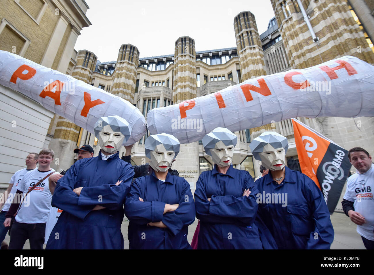 London, UK. 17th Oct, 2017. Public sector workers, several wearing masks depicting Theresa May, Prime Minister, as a 'MayBot' outside the Department of Health ahead of a rally in Parliament Square against the cap on public sector workers' pay. Credit: Stephen Chung/Alamy Live News Stock Photo