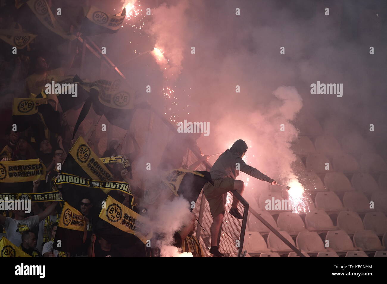 Nicosia, Cyprus. 17th Oct, 2017. Dortmund fans light fireworks in the stands during the Champions League group stages qualification match between APOEL Nicosia and Borussia Dortmund in the GSP Stadium in Nicosia, Cyprus, 17 October 2017. Credit: Angelos Tzortzinis/dpa/Alamy Live News Stock Photo