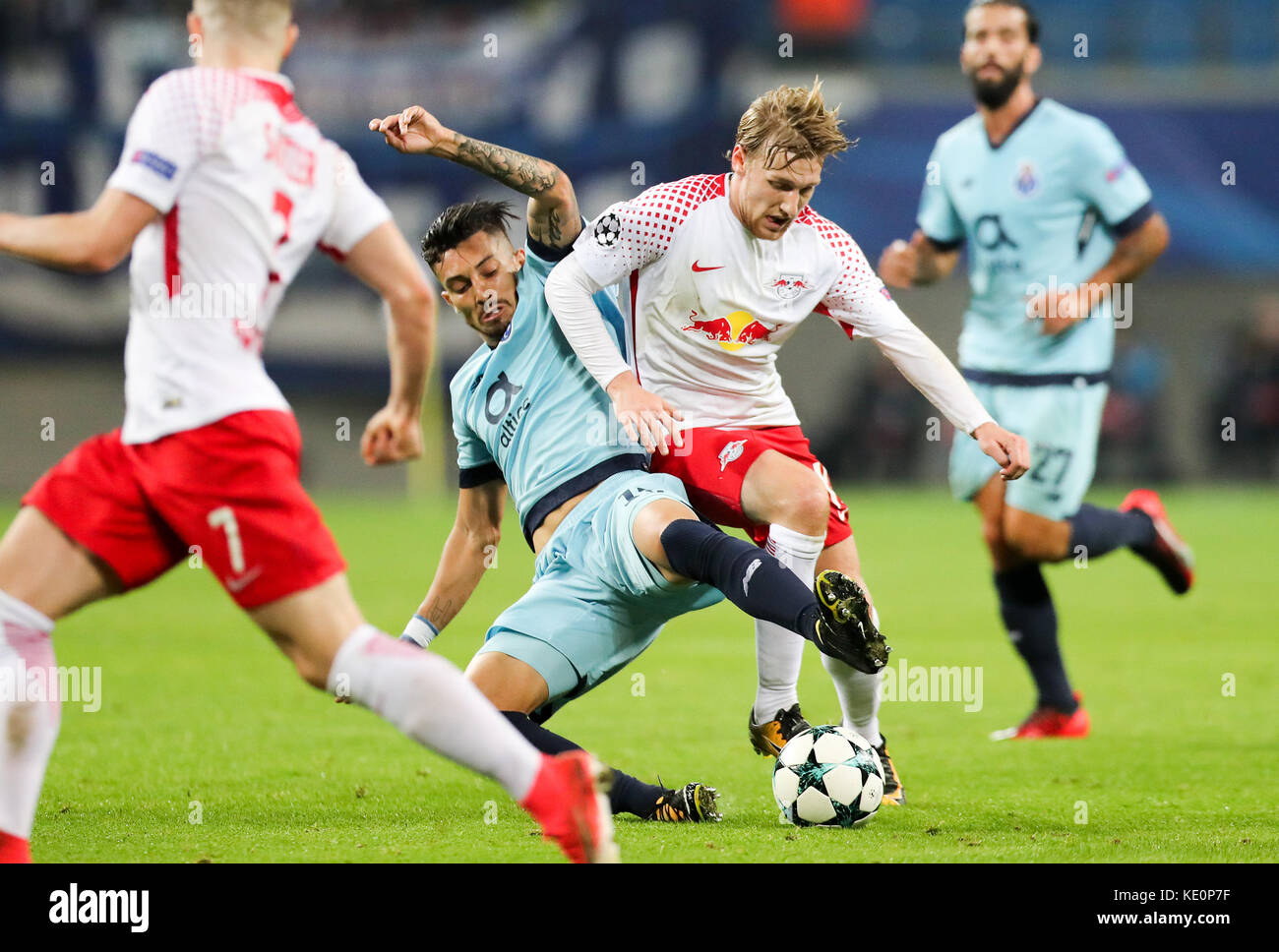 Leipzig, Germany. 17th Oct, 2017. Leipzig's Emil Forsberg and Porto's Alex Telles vie for the ball during the Champions League group stages qualification match between RB Leipzig and FC Porto in the Red Bull Arena in Leipzig, Germany, 17 October 2017. Credit: Jan Woitas/dpa-Zentralbild/dpa/Alamy Live News Stock Photo