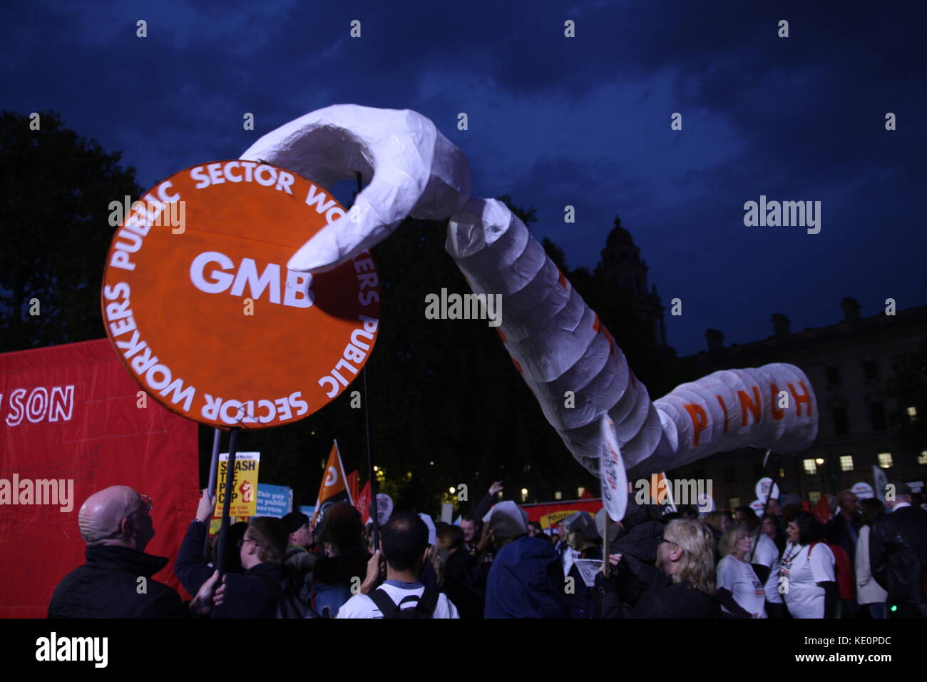 London, UK. 17th October 2017. The TUC holds a rally in Westminster to protest the 1% cap on payrises to government employees. A giant hand pinches pay. Roland Ravenhill/Alamy Live News Stock Photo