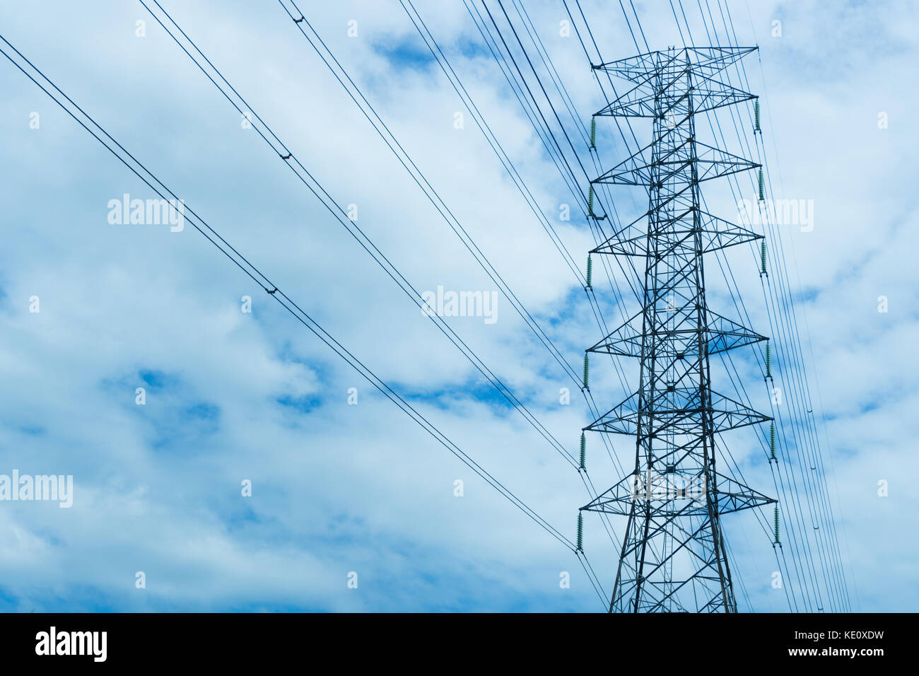high voltage pole blue sky background Stock Photo - Alamy