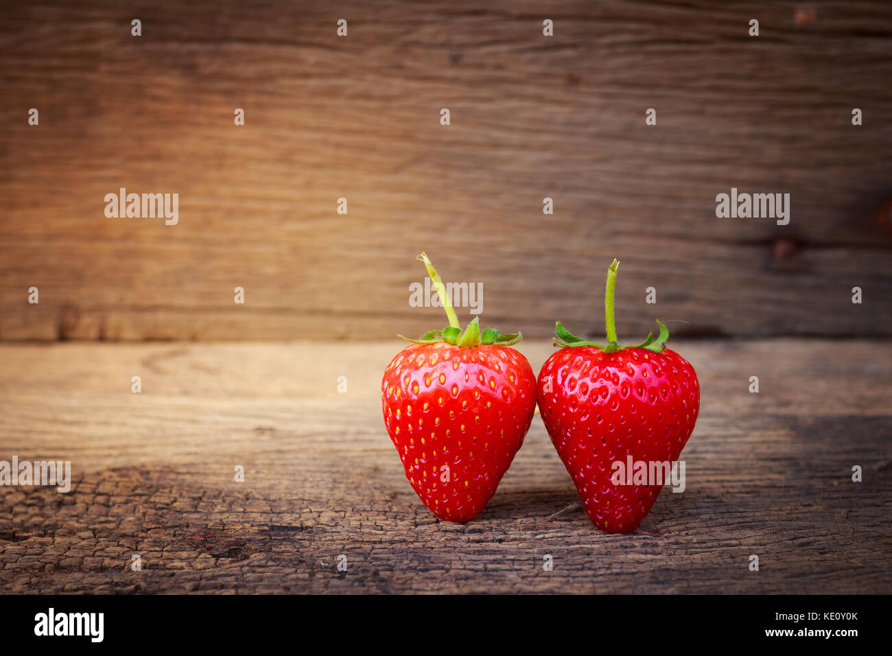 strawberry on a dark wood background Stock Photo - Alamy