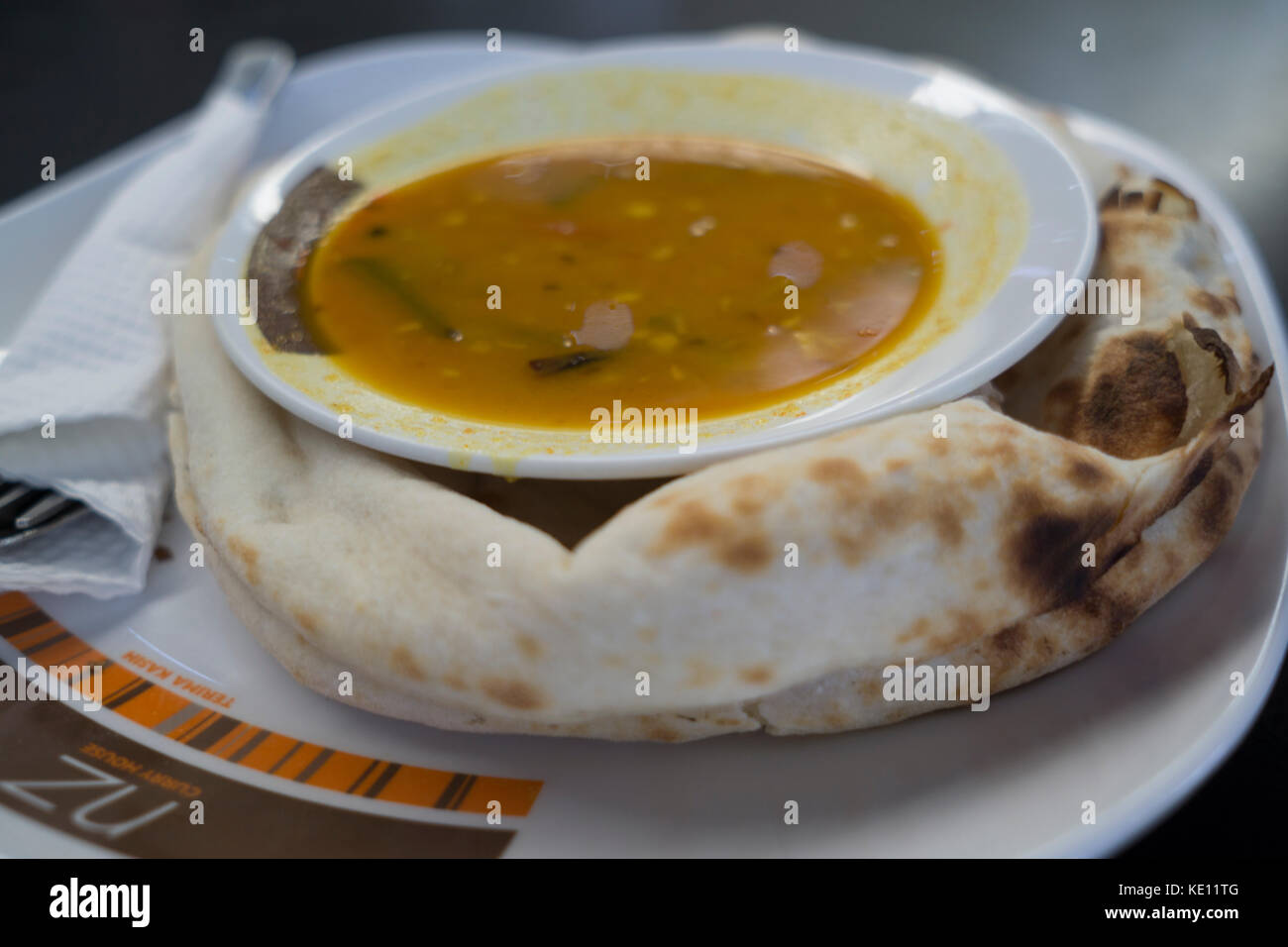 A dish of Roti Bread & Dhal served in a Street Food Restaurant,Kuala Lumpur,Malaysia Stock Photo