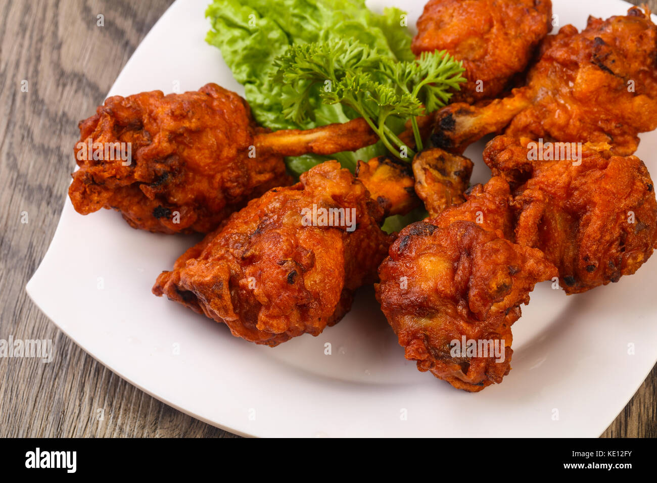Indian traditional cuisine Chicken lollipops with spices Stock Photo