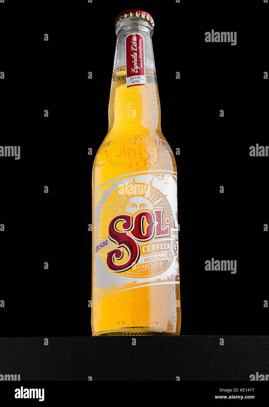 LONDON, UK - DECEMBER 15, 2016: Bottle of Sol Mexican Beer on black background. From the Cuauhtemoc Moctezuma Brewery, in Monterey, Mexico, it was fir Stock Photo