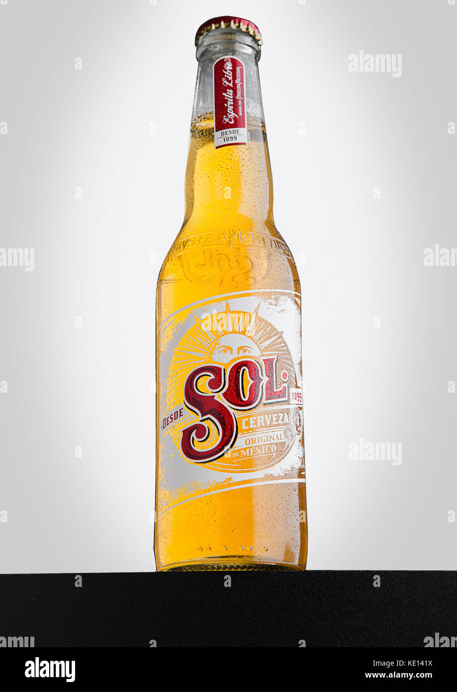 LONDON, UK - DECEMBER 15, 2016: Bottle of Sol Mexican Beer on white background. From the Cuauhtemoc Moctezuma Brewery, in Monterey, Mexico, it was fir Stock Photo