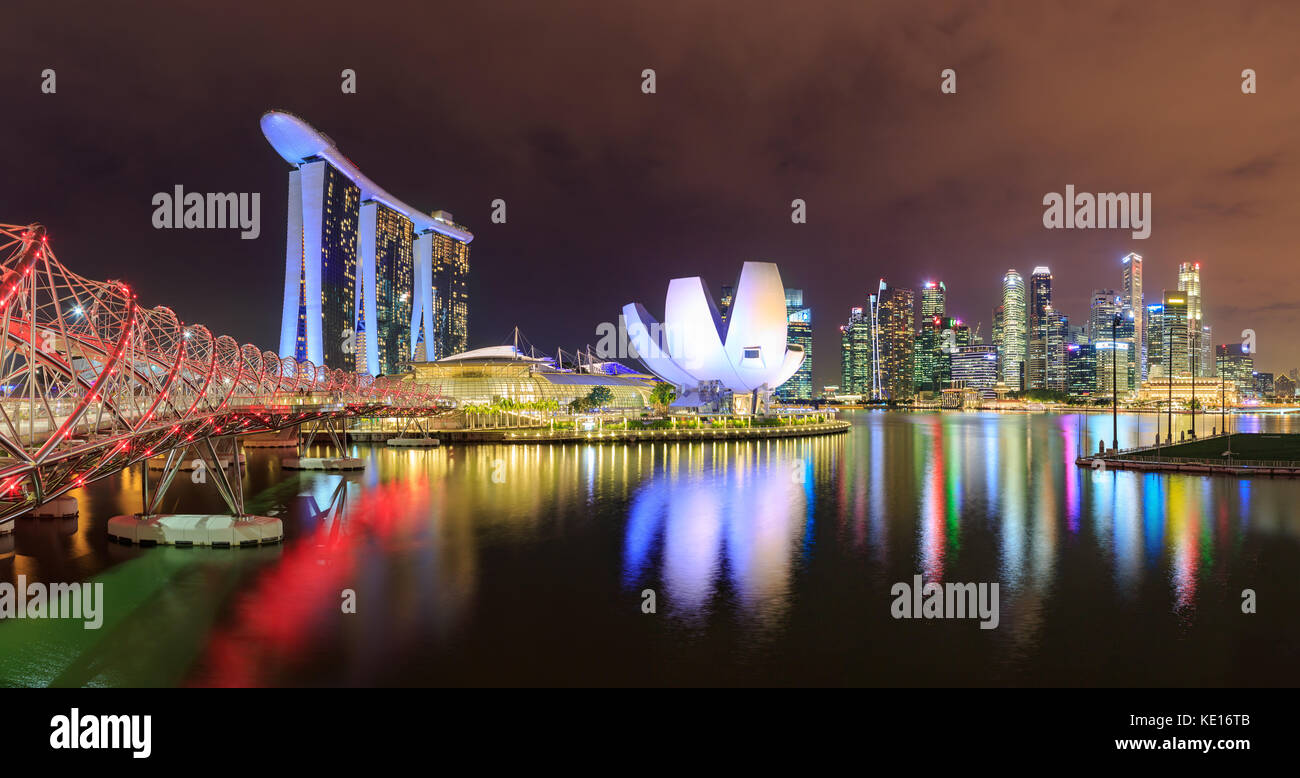 Marina Bay view with Marina Bay Sands Hotel and skyline of Singapore town by night Stock Photo