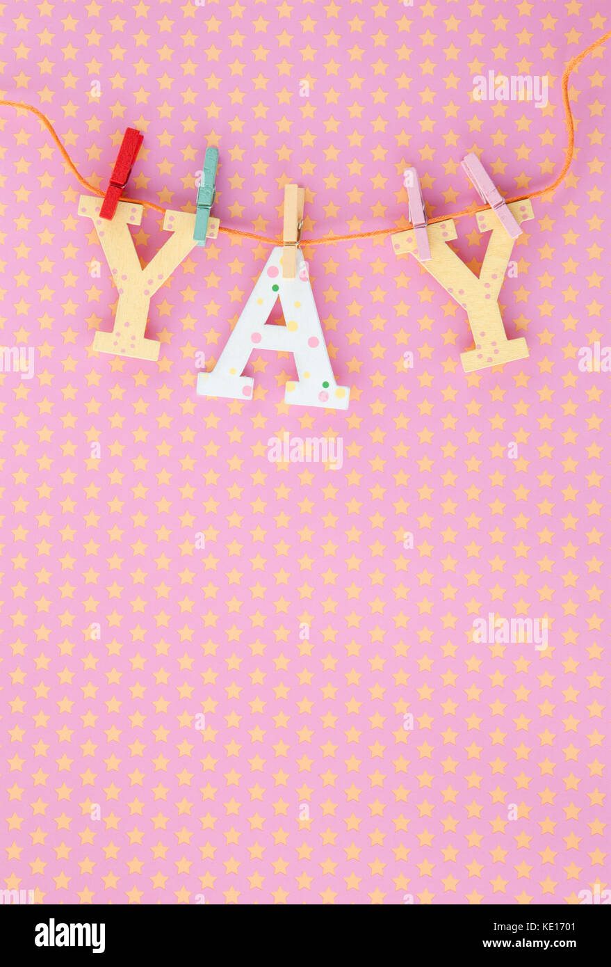 Colorful YAY banner on pink and yellow stars Stock Photo