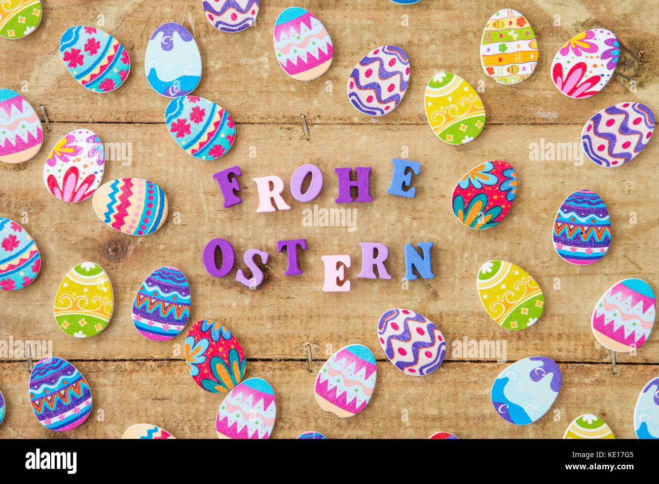 Colorful decorations for easter on wooden background Stock Photo - Alamy