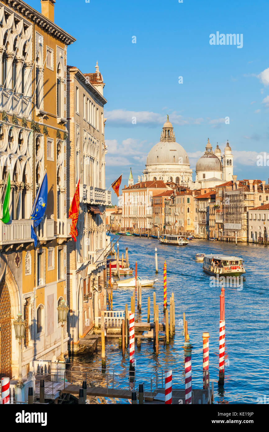 Venice italy venice Vaporettos actv water taxi or water bus and small motor boats Venice Grand Canal near santa maria della salute church Venice Italy Stock Photo