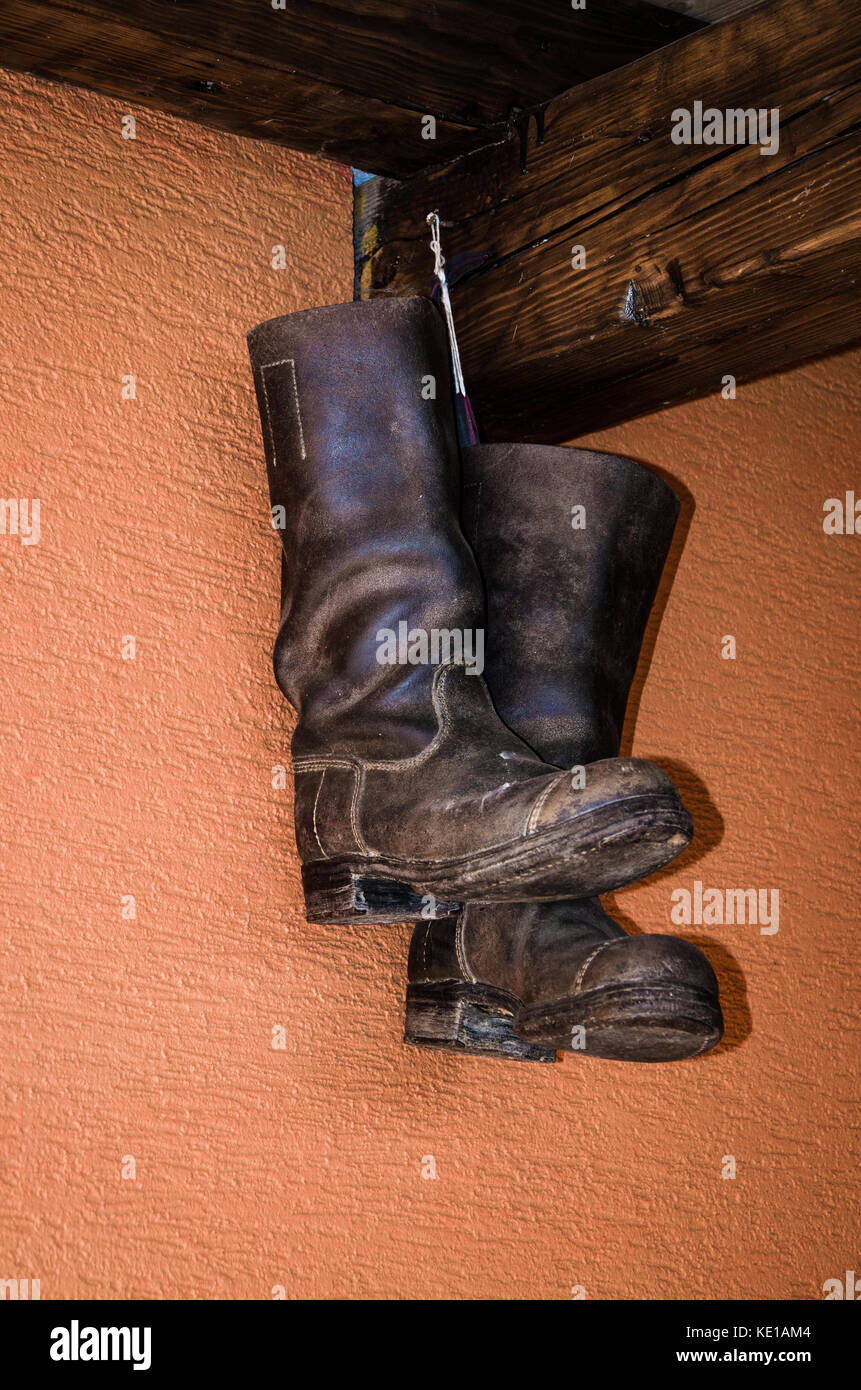 boots hanged on the wall Stock Photo Alamy