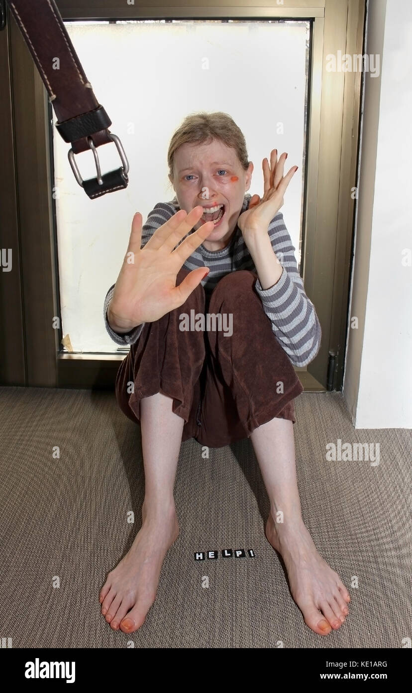 Scared girl beaten up with leather belt Stock Photo 163528948 Alamy
