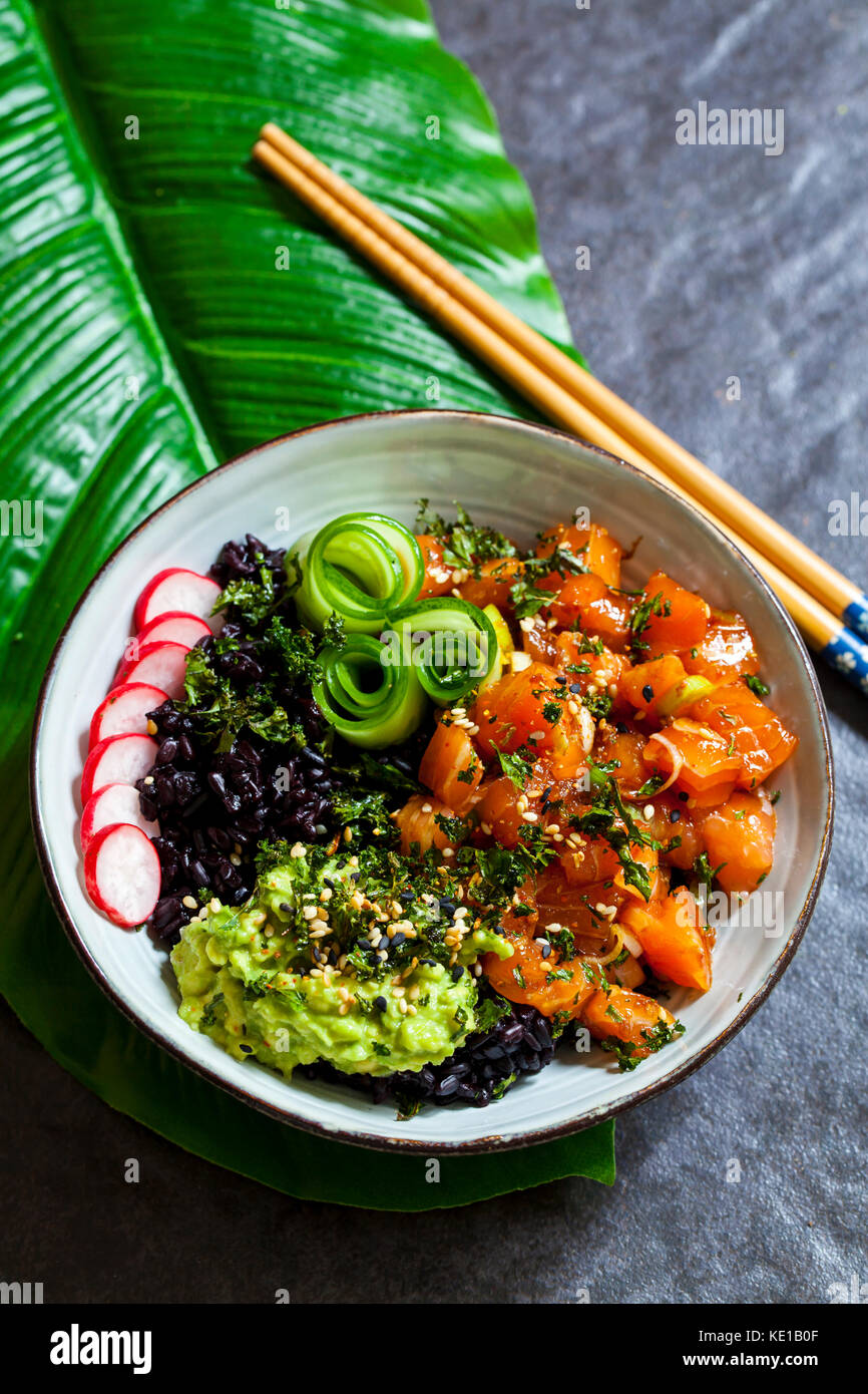 Salmon ahi poke with black forbidden rice, pickled cucumber, avocado