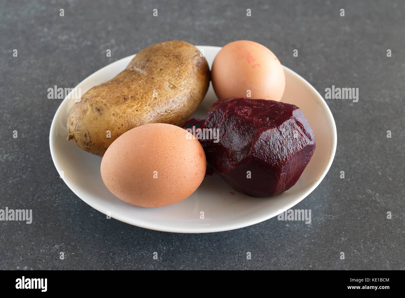 Boiled potatoes, beetroot and eggs. ingredients. Stock Photo