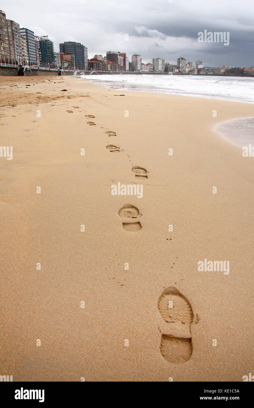 Foot prints in San Lorenzo beach at Gijon, Asturias, Spain. Stock Photo