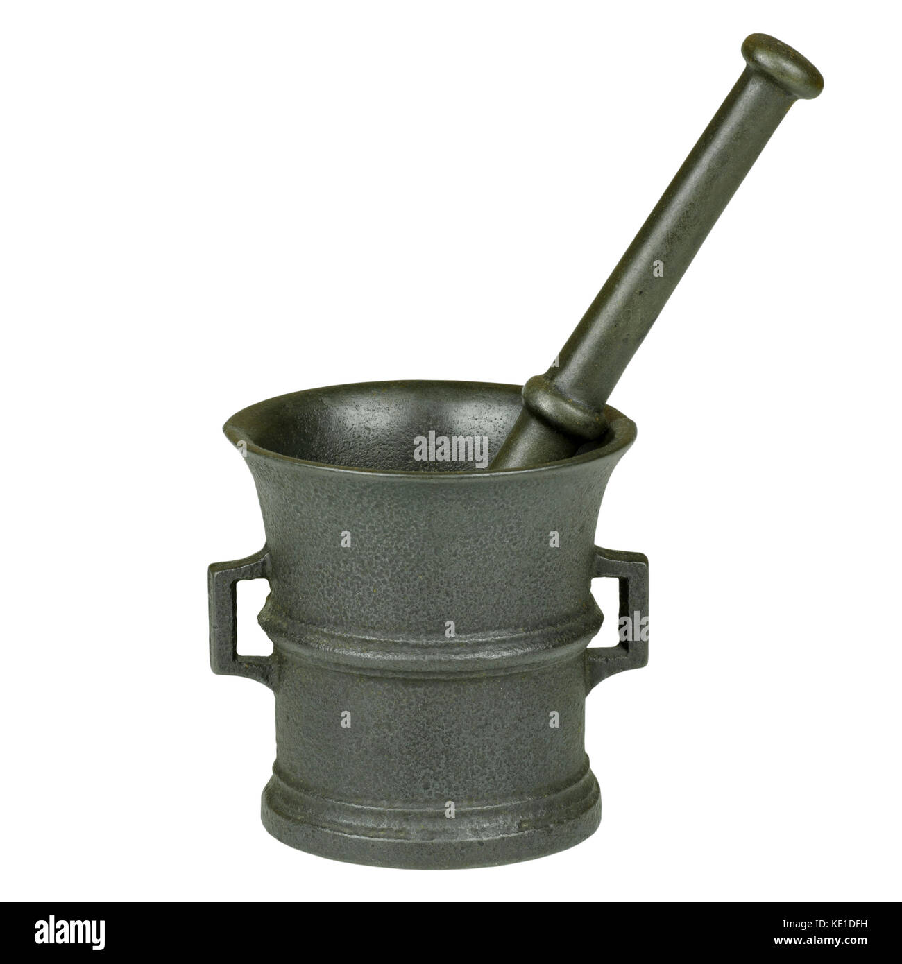 Close-up photo of a cast-iron mortar with a stick isolated on a white background Stock Photo