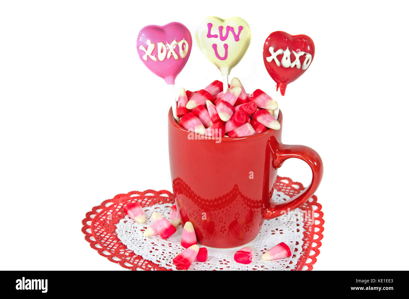 candy corn in red mug with Valentine heart suckers Stock Photo - Alamy