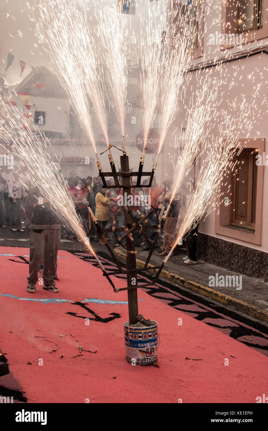 Fire on street decorated with coloured salt during Fiesta del Carmen celebrations. La Isleta, Las Palmas, Gran Canaria, Canary Islands, Spain Stock Photo