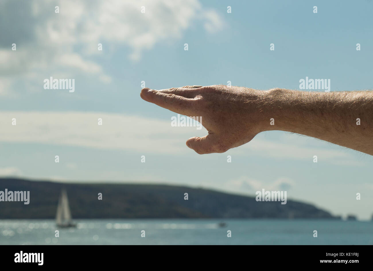 Man's arm, pointing out places of interest, gesticulating - photo Stock Photo