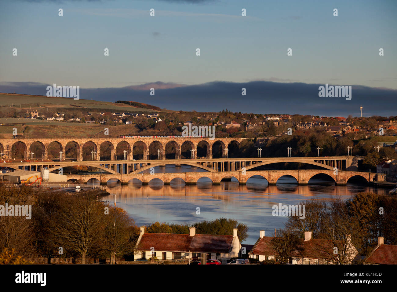 Bridges over the river tweed,Berwick upon Tweed An Arriva Crosscountry train crosses the Royal border bridge in the background. Stock Photo