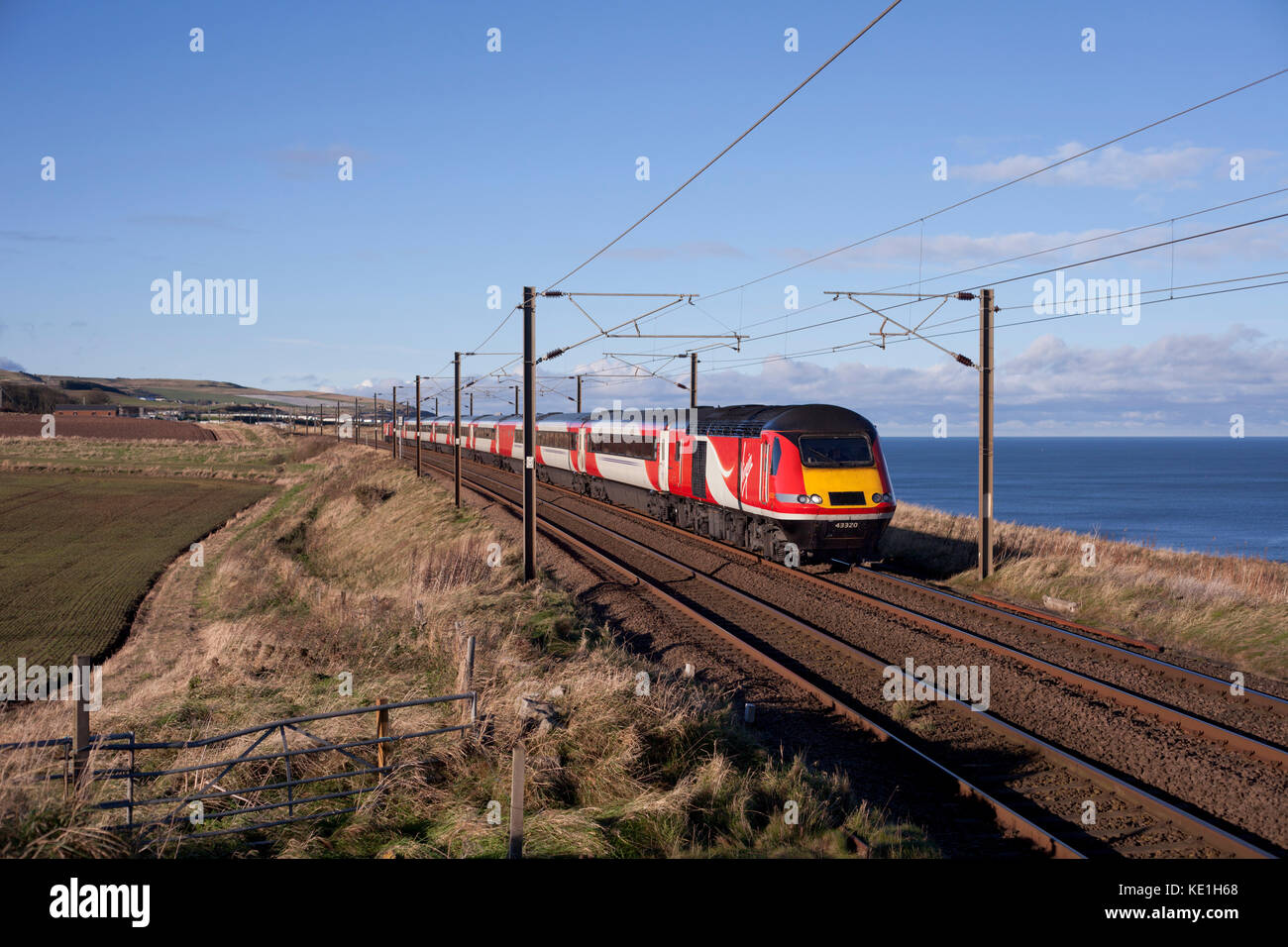 The 0952 Aberdeen - Kings Cross passes  Marshall meadows, (north of Berwick upon Tweed) formed of a Virgin Trains east Coast Intercity 125 Stock Photo
