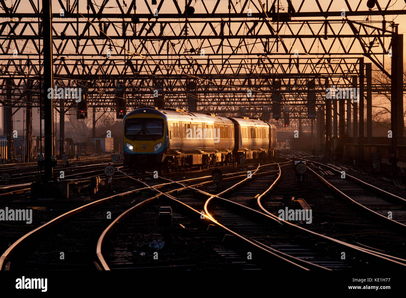 A Transpennine express class 185 DMU arrives at Manchester Piccadilly  with the  0704 York - Manchester Airport as the sun rises Stock Photo