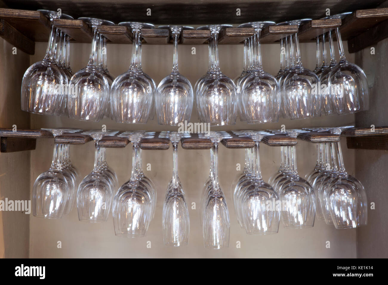 A rack holding wine glasses in a pub in Wiltshire, England. Stock Photo