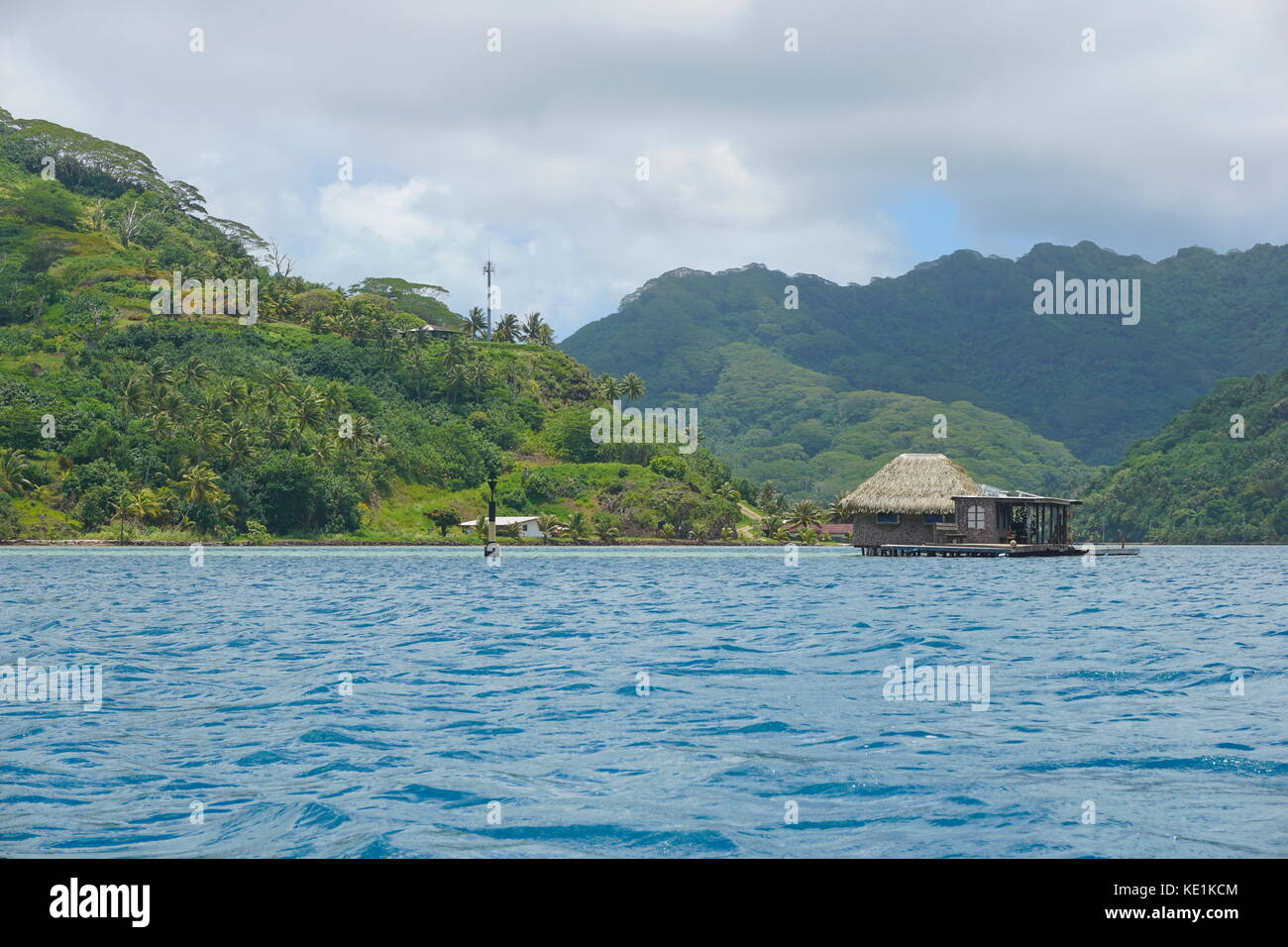 French Polynesia Huahine island coastline with a pearl oyster farm over the water in the lagoon, Faie, south Pacific ocean Stock Photo