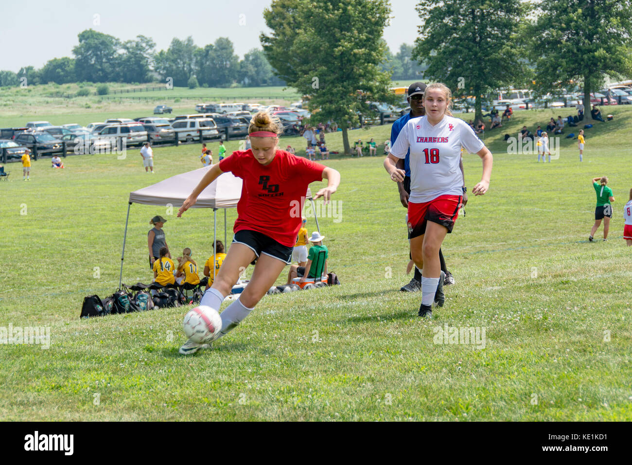 American high school teenage girls playing soccer in a game tournament Stock Photo