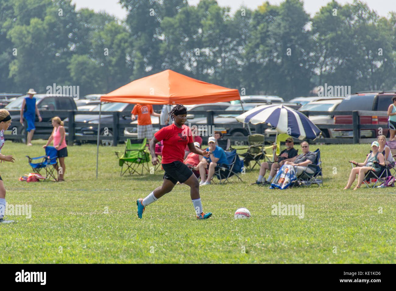 American high school teenage girls playing soccer in a game tournament Stock Photo