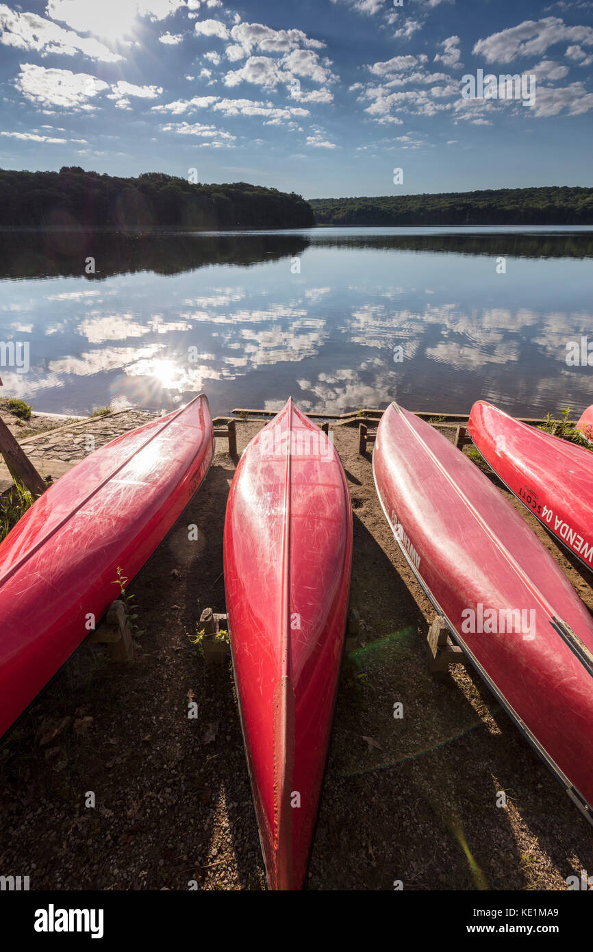 Red canoes on the shore of Kettle's Lake in Awenda Provincial Park