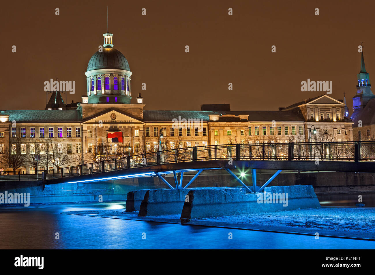 Facade of Bonsecures Market at night from Basin Park including the Basin Park Bridge near the Old Port of Montreal, Quebec, Canada. Stock Photo
