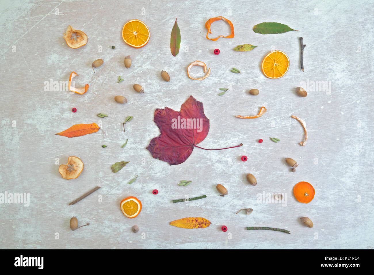 Flat Lay Autmnal Objects with Red Maple Leaf in the Centre Stock Photo