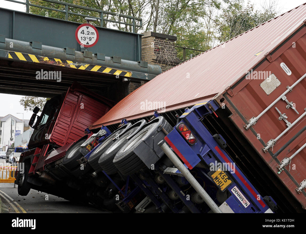 An articulated lorry which hit a bridge in Coombe Valley Road, Dover, this morning. The lorry was left on its side after the collision. Stock Photo
