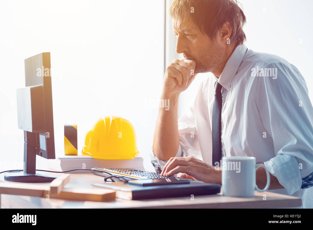 Architect working in office, construction engineer working with desktop