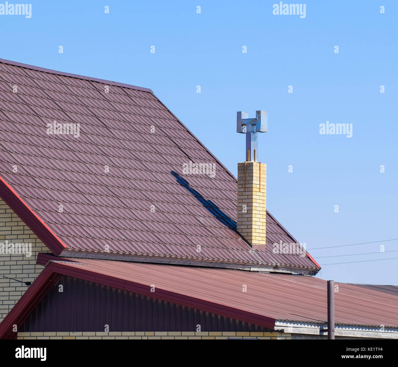 Brown corrugated metal profile roof. The roof of corrugated sheet