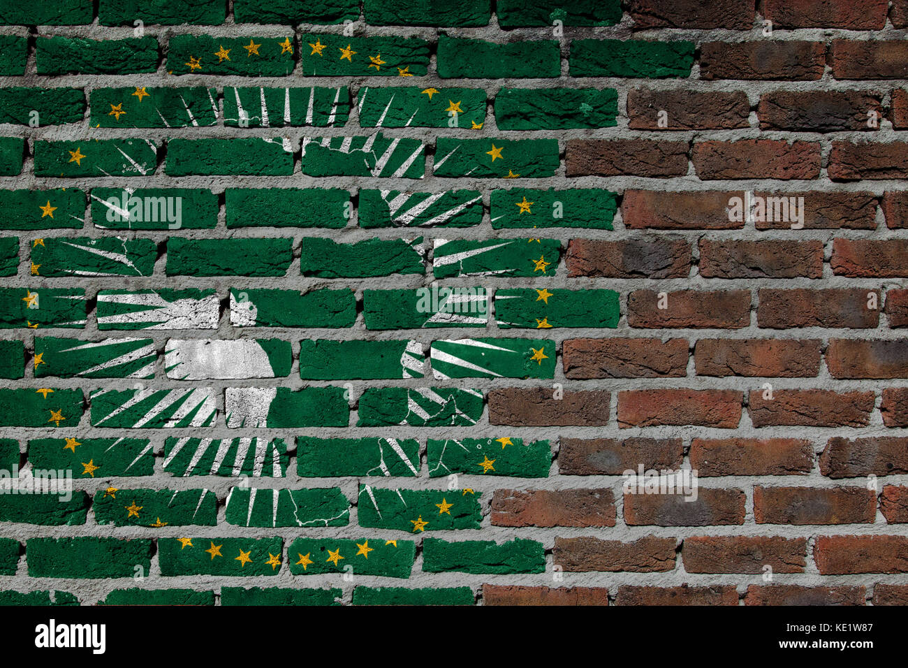 Very old dark red brick wall texture - Flag of African Union Stock Photo