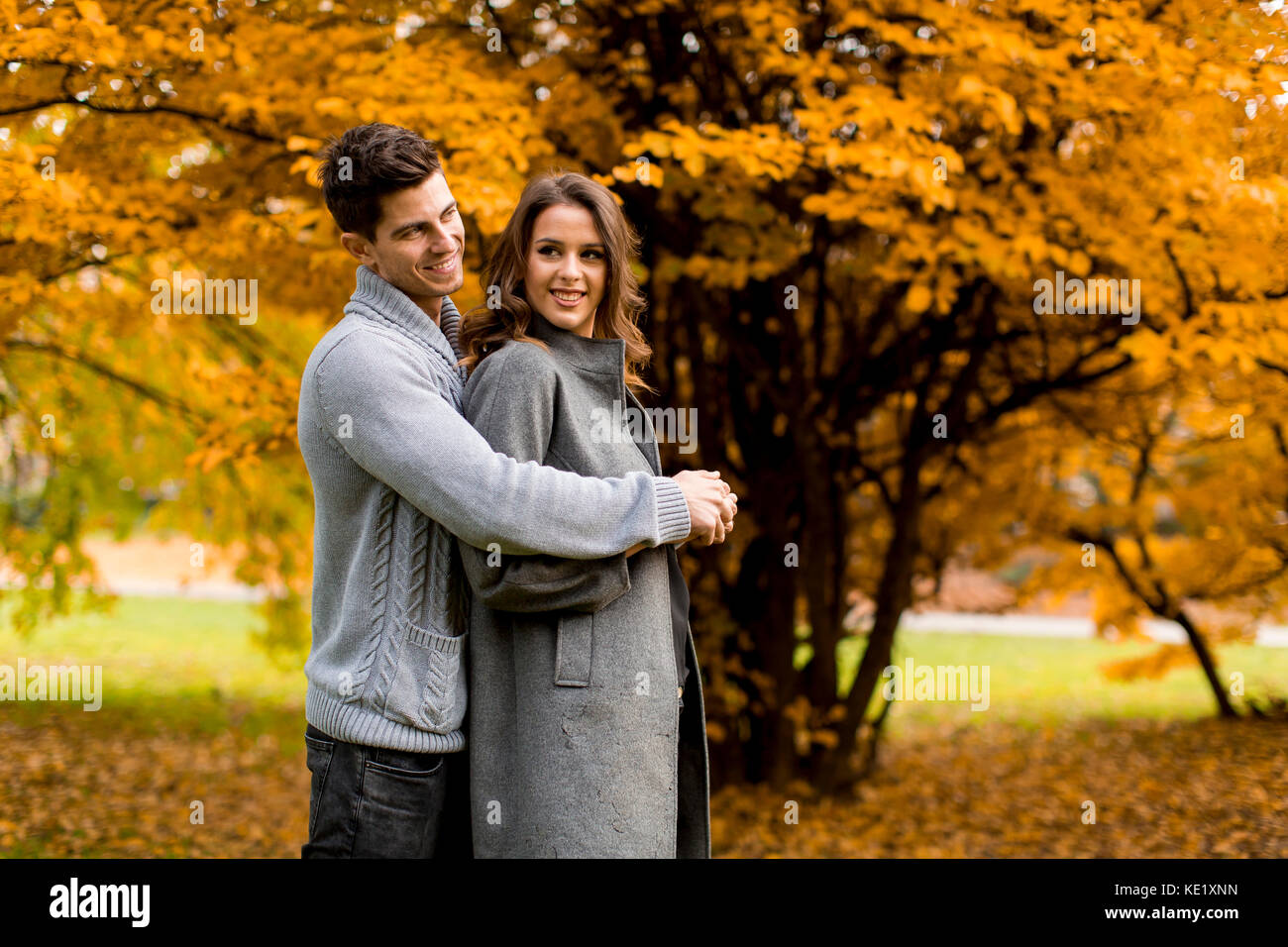 Young couple in love in the autumn forest Stock Photo - Alamy