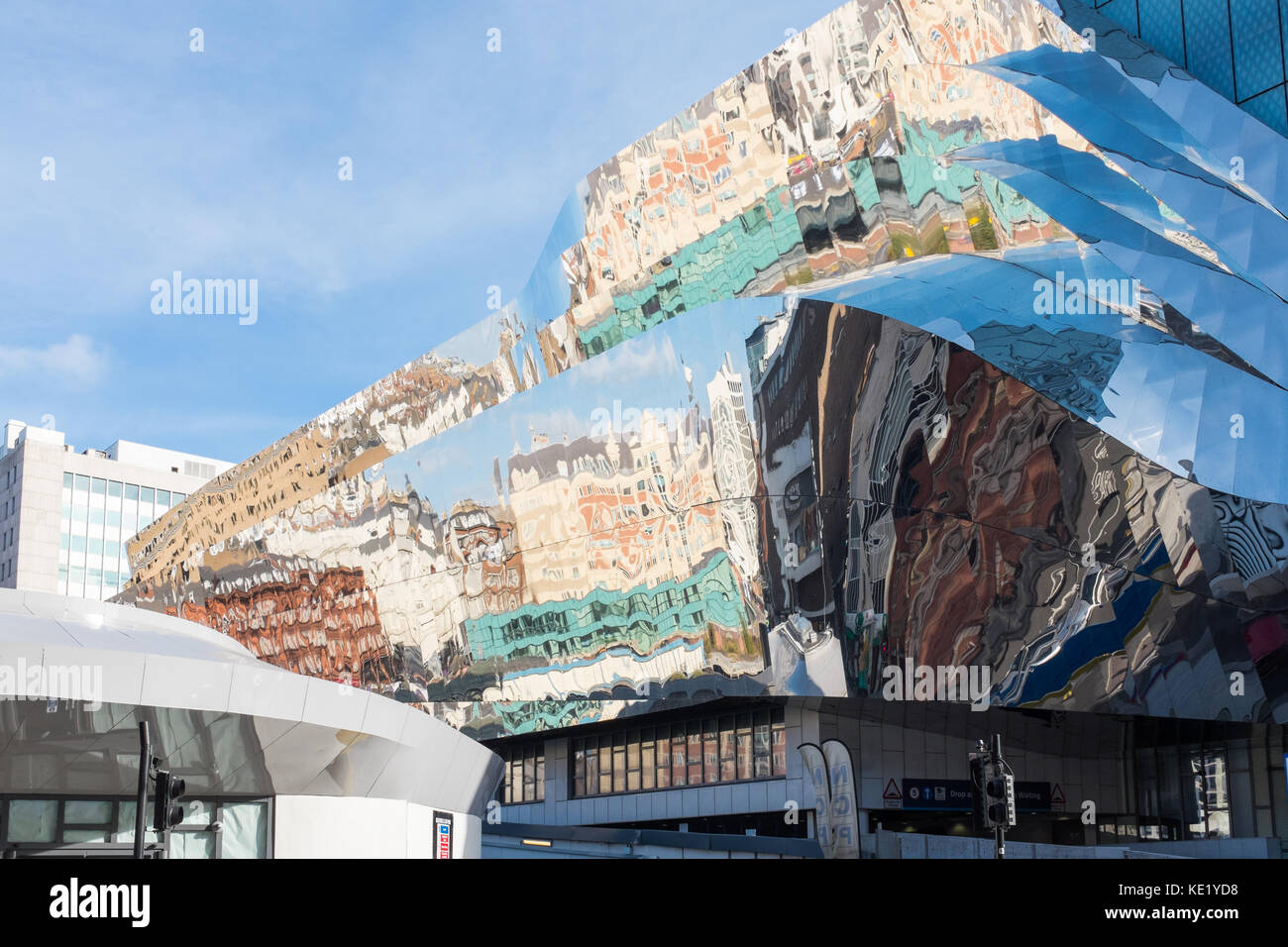 Buildings reflected on the shiny cladding of Birmingham New Street Station Stock Photo