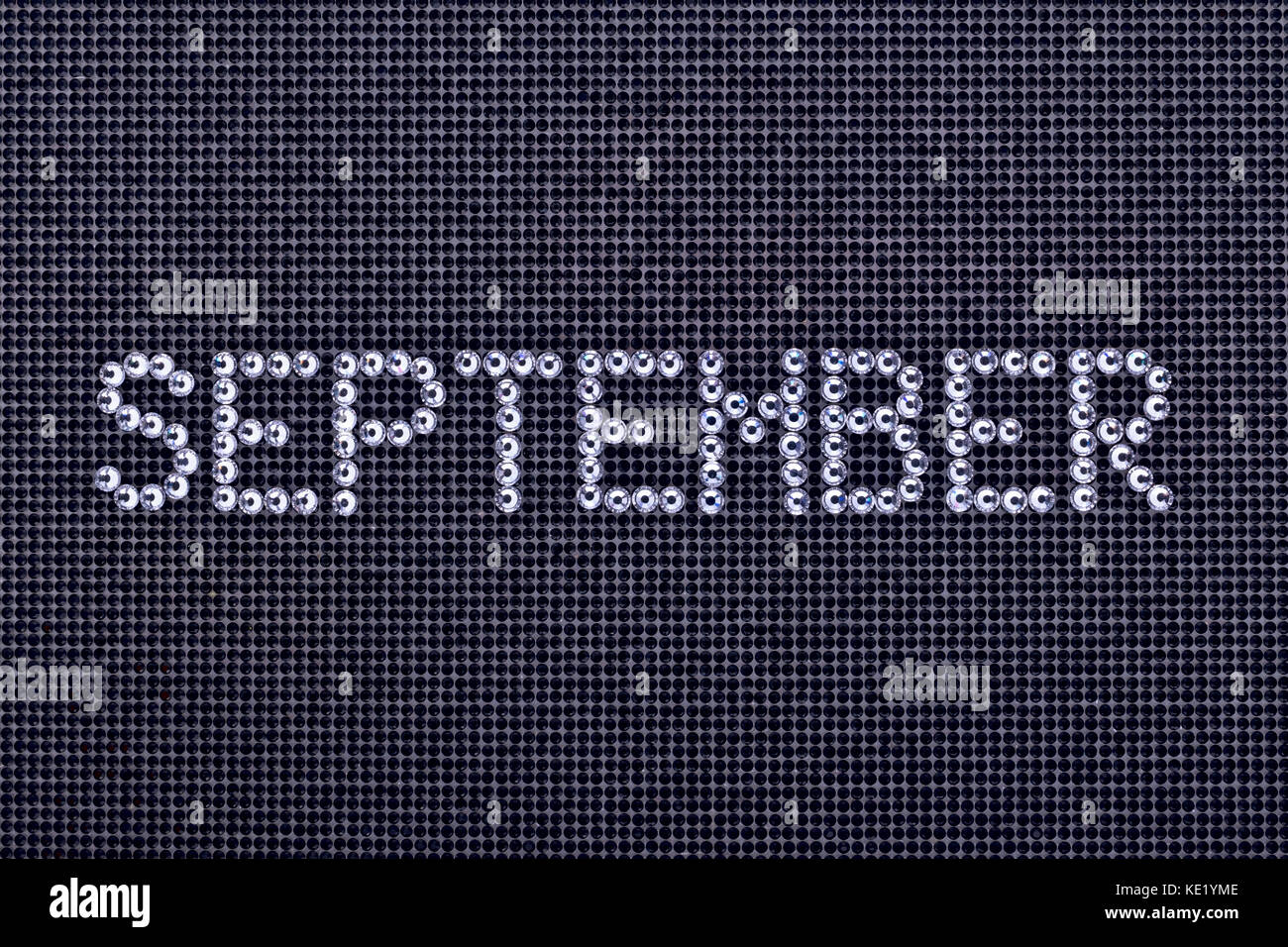 Month SEPTEMBER is made rhinestones crystal color on a black canvas ...