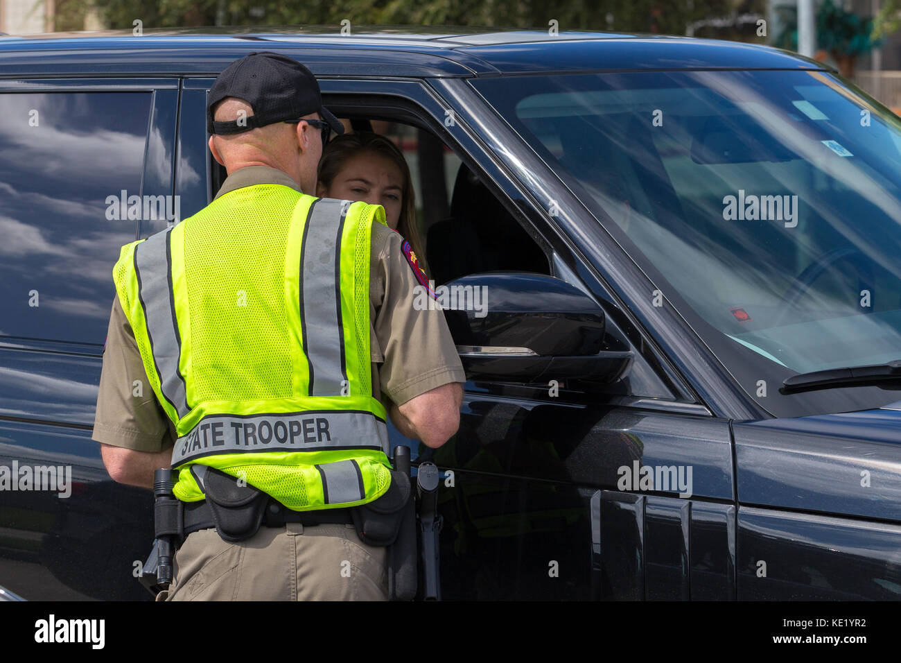 Texas State Trooper speaking with a car drive Stock Photo