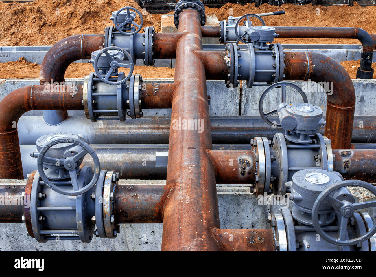 Steel fuel pipes without paint with rust and valves at the oil refinery