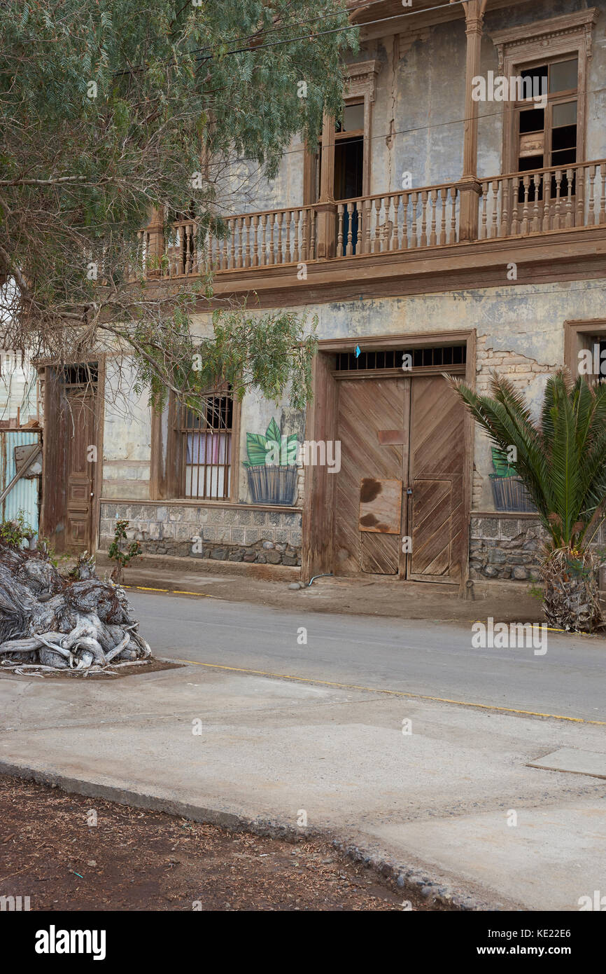 Historic wooden buildings from the era of nitrate mining in the Atacama Desert, in the coastal town of Pisagua in northern Chile. Stock Photo