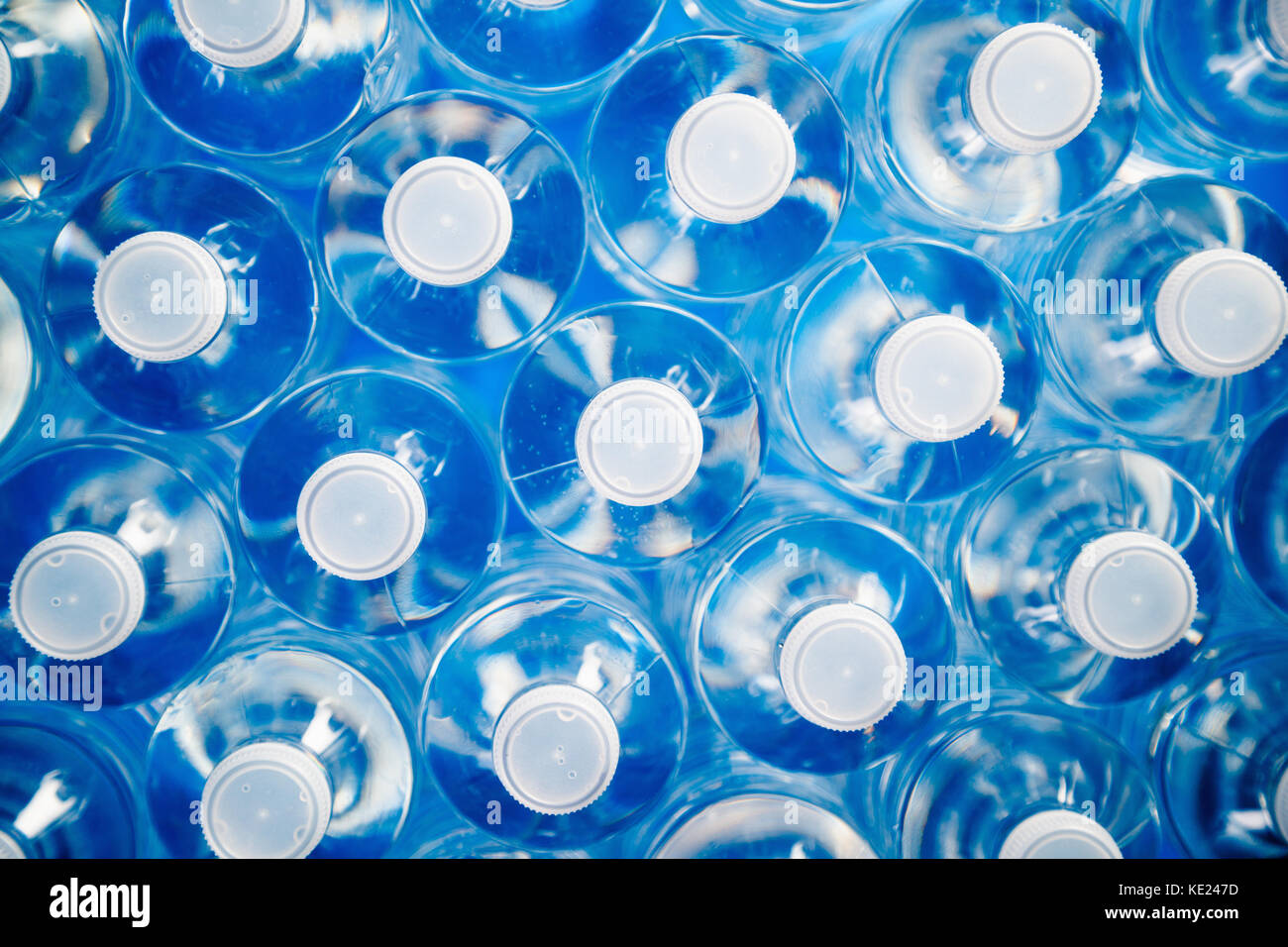 High angle view of plastic water bottles in a row. Concept of