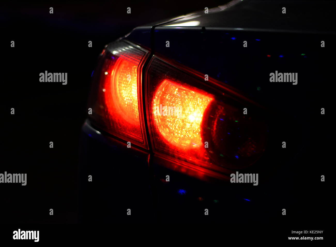 Discounted rear car lights in the dark. Stop signals Stock Photo Alamy