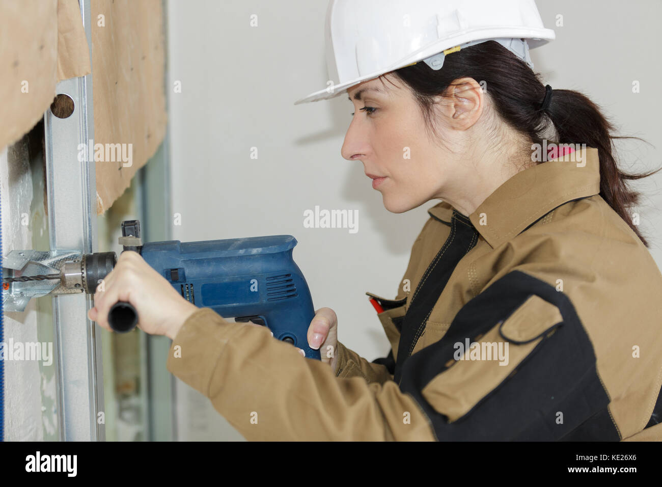 woman drilling hole using circular attachment Stock Photo Alamy